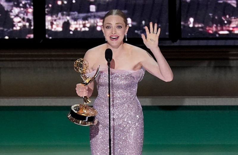 Amanda Seyfried accepts the Emmy for outstanding lead actress in a limited or Anthology series or movie for 'The Dropout'. AP 