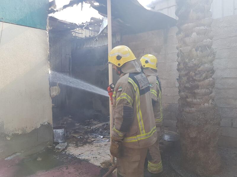 Fire fighters came to the aid of an elderly woman after a fire ripped through her home in Ras Al Khaimah. Courtesy Ras Al Khaimah Civil Defence
