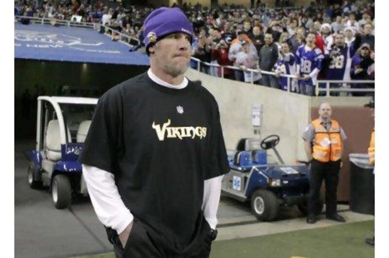 Brett Favre looks out over Ford Field in Detroit on Monday night after he was inactive for the Vikings against the Giants, ending his 297-game streak.