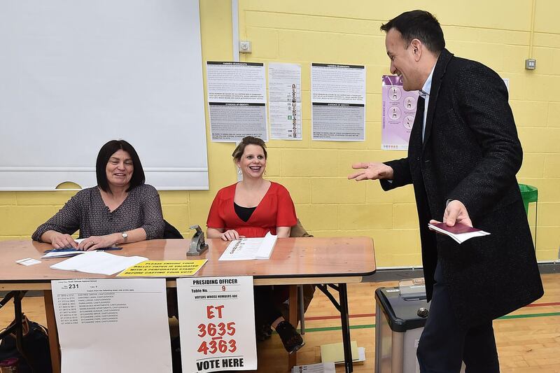 Taoiseach Leo Varadkar jokes with electoral officers as he casts his vote in the Irish Election in Dublin, Ireland. Getty Images