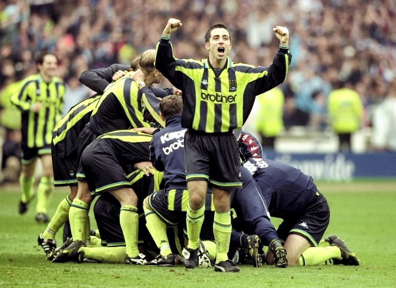 30 May 1999:   Manchester City players celebrate promotion and victory after the Nationwide Division Two Play-Off Final match against Gillingham played at Wembley Stadium in London, England.  The match finished in a 2-2 draw after extra-time and in the penalty shoot-out Manchester City won 3-1 and were promoted to Division One. \ Mandatory Credit: Alex Livesey /Allsport