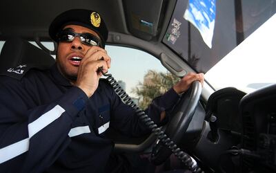 April 28, 2008 / Abu Dhabi /  Lt Mohamed al Bahri a paramedic with the Emergency and Public Safety Department Ambulance section calls dispatch to inform them of a minor traffic accident on the Corniche in Abu Dhabi April 28, 2008. (Sammy Dallal / The National) *** Local Caption *** na02-emergencyMain.jpg