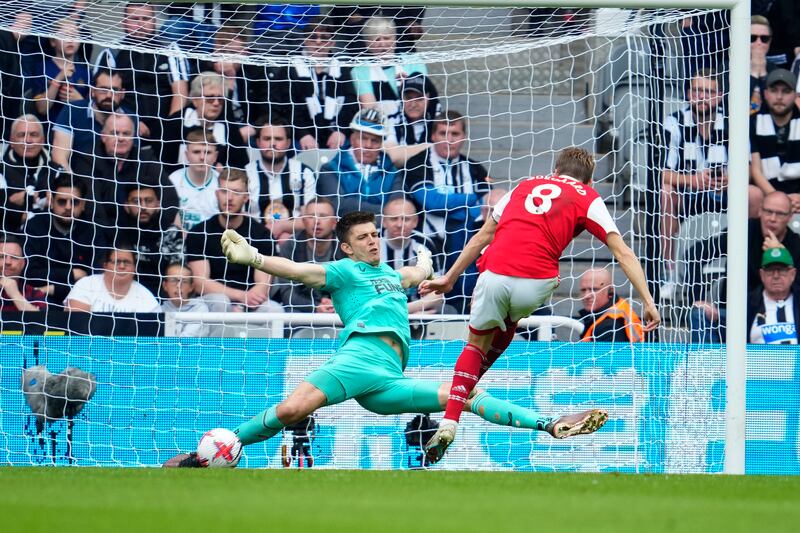 Arsenal's Martin Odegaard's shot is saved by Newcastle goalkeeper Nick Pope. AP 