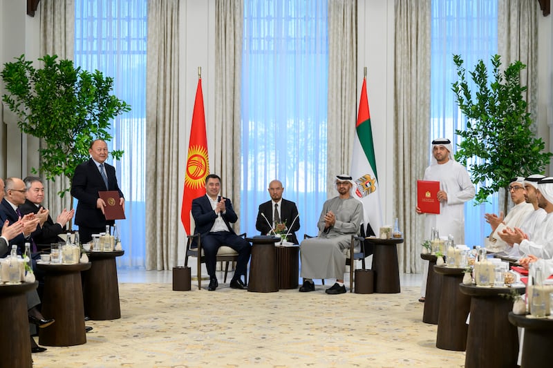 Falah Al Ahbabi, member of Abu Dhabi Executive Council and chairman of the Department of Municipalities and Transport, and Mayor of Bishkek Emilbek Abdykadrov exchange agreements.