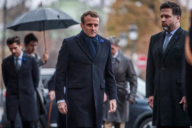 epa07988025 French President Emmanuel Macron (C) arrives to lays a wreath in front of the statue of Georges Clemenceau in Paris, France, 11 November 2019, as part of the commemorations marking the 101st anniversary of the 11 November 1918 armistice, ending World War I (WWI).  EPA/CHRISTOPHE PETIT TESSON / POOL