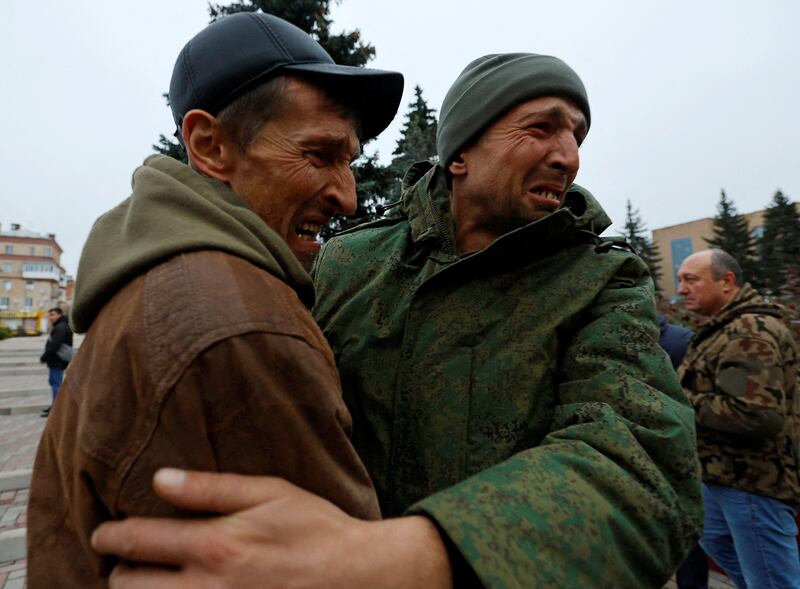 A man hugs his brother after his release along with other military personnel from Russian-controlled parts of Donetsk and Luhansk regions. Reuters