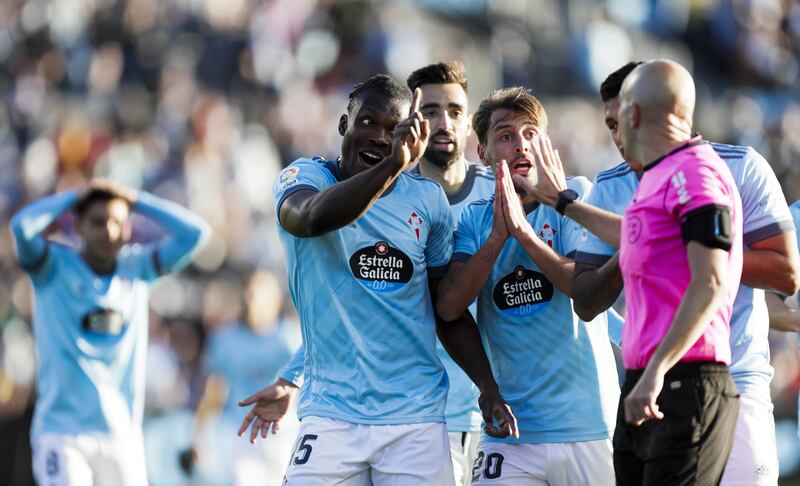 Celta Vigo players argue with referee Gonzalez Fuertes after he awards a penalty to Real Madrid. EPA