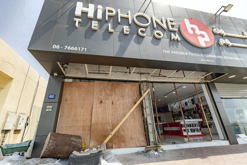 Umm Al Quwain, United Arab Emirates - July 08, 2019: Hi phone Telecom shop after a driver crashed into it. Monday the 8th of July 2019. Umm Al Quwain. Chris Whiteoak / The National