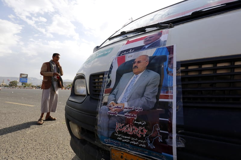 epa06153258 Posters depicting former president Ali Abdullah Saleh are placed on a bus ahead of an anniversary celebration of Saleh’s party, General People's Congress, in Sana’a, Yemen, 20 August 2017. According to reports, the Houthi rebels have accused Yemen’s ex-president Ali Saleh and his party, General People’s Congress, (GPC) of exerting political extortion and following policies that support the Saudi-led military coalition fighting the Houthi rebels for more than two years.  EPA/YAHYA ARHAB