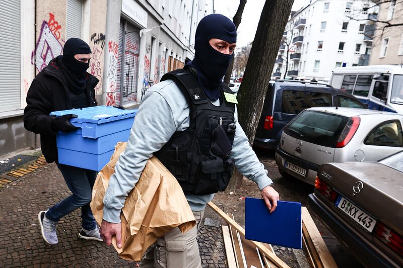 German police remove items during a raid on a property in Berlin over connections to the militant group Hamas and Samidoun, a pro-Palestinian organisation. EPA