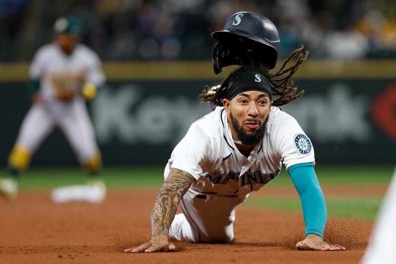 Seattle Mariners' JP Crawford dives during the MLB game against the Oakland Athletics on Tuesday, September  28. AP
