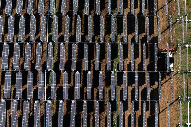 Hanging solar panels in France. Capital investment in renewables is set to hit $494 billion in 2022. AFP