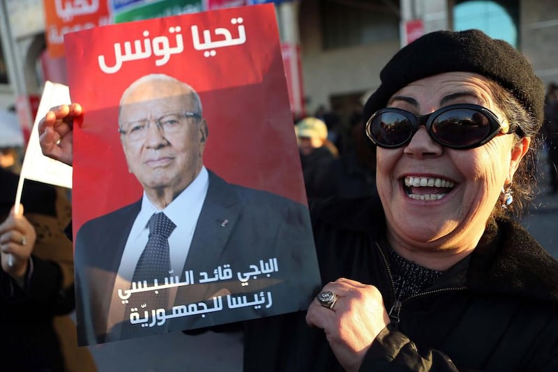 A fan of Tunisian president-elect Beji Caid Sebsi celebrates the election result. Photo: Mohamed Messara / EPA

