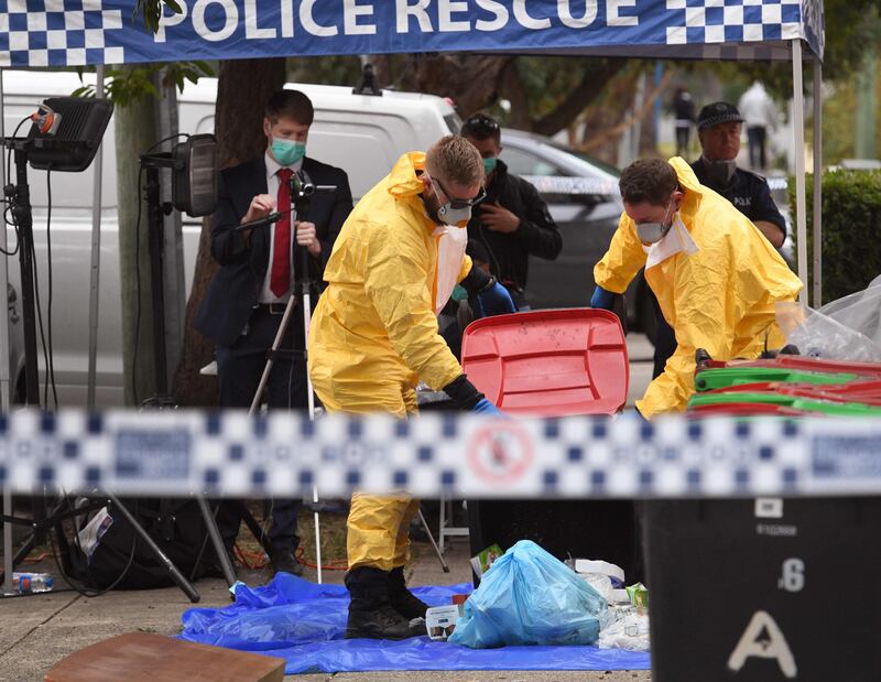 Police search for evidence at a block of flats in the Sydney suburb of Lakemba. William West.