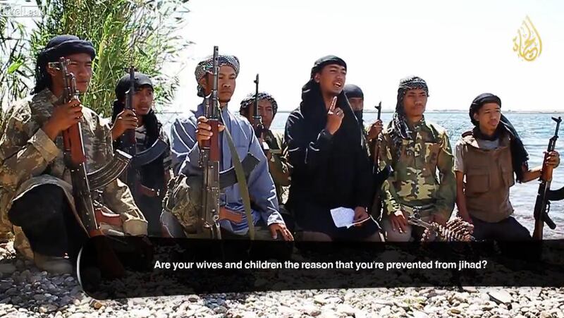 Screen grab of a propaganda video released by ISIL showing Indonesian fighters in Syria trying to recruit their countrymen.