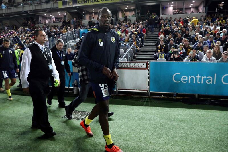 Usain Bolt walks on the sidelines before making an appearance for Central Coast Mariners during a pre-season friendly. AFP
