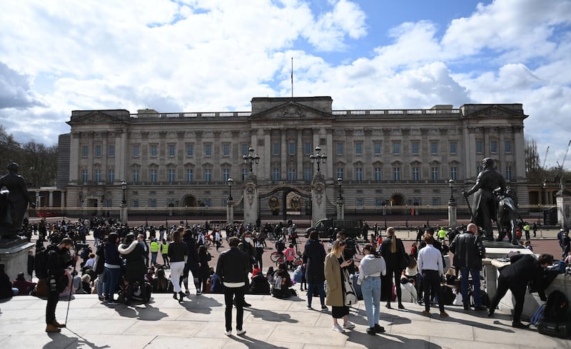 People gather outside Buckingham Palace. EPA