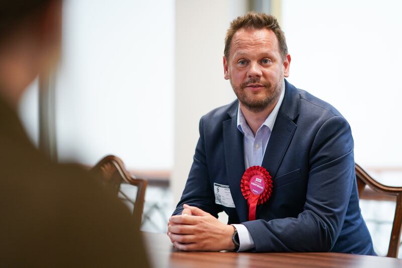 Labour Party by-election candidate Simon Lightwood speaks with students at Wakefield college. Getty Images