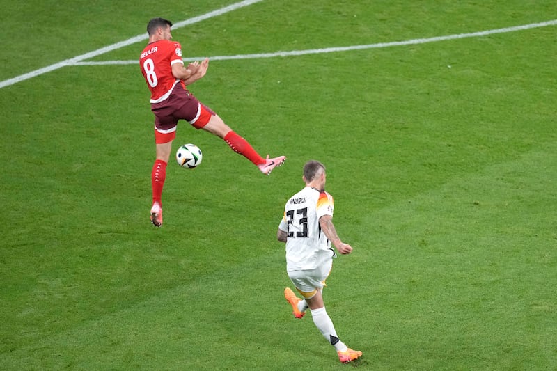 Germany's Robert Andrich scores a goal that was disallowed by VAR because of a foul by Jamal Musiala on Switzerland defender Michel Aebischer in the build-up. AP 