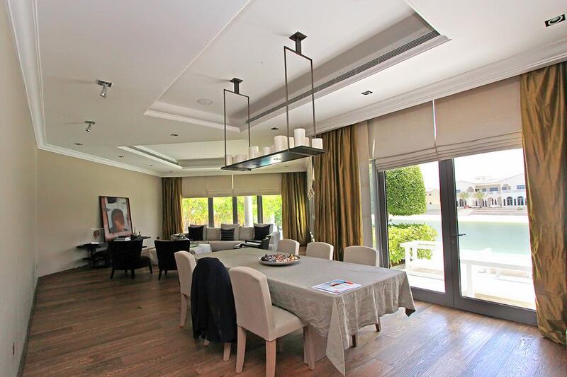 The villa is designed with a separate living room and dining room. Courtesy  Fine and Country