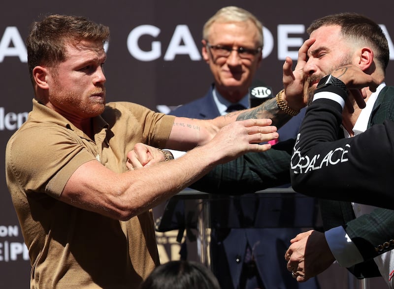 Canelo Alvarez slaps Caleb Plant during a face-off before a press conference ahead of their super middleweight fight on November 6 at The Beverly Hilton. AFP