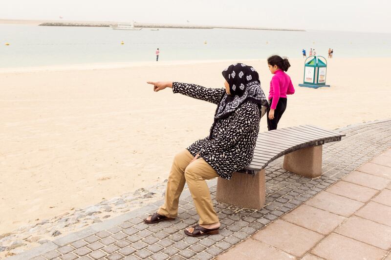 DUBAI, UNITED ARAB EMIRATES,  21 MARCH 2017. 
A woman points to the sea on Mamzar beach.

 Photo: Reem Mohammed / The National 

(Section: STANDALONE)  *** Local Caption ***  RM_20170321_DUBAI_009.JPG