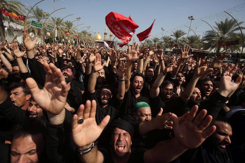Iraqi Shiites take part in commemorations on the 10th day of Muharram, in Karbala. Mohammed Sawaf / AFP