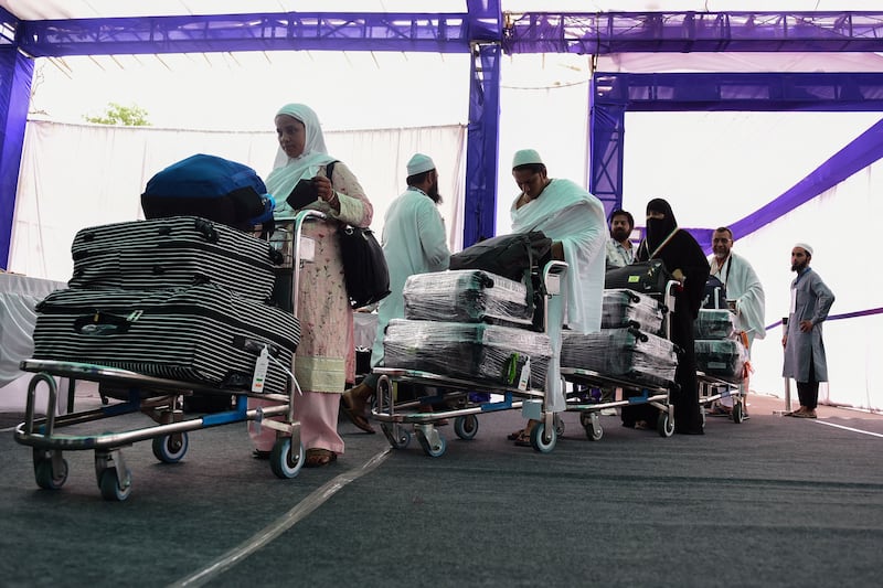 Muslims devotees bound to Makkah for the Hajj pilgrimage arrive at the airport in Ahmedabad, India. AFP