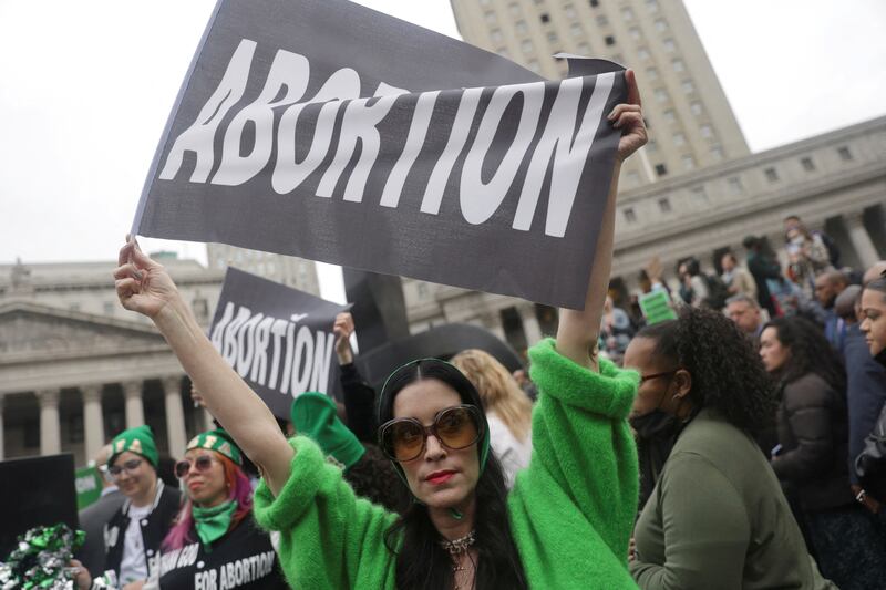 A woman holds up a flag during a protest in Foley Square in New York. Reuters