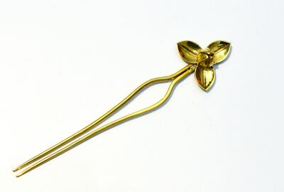 A custom-made hairpin by designer Chantha Thoeun, depicting the national flower of Cambodia. Courtesy Ronan O'Connell