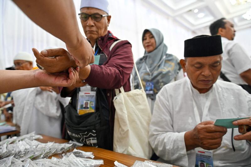 Pilgrims undergo identity checks in Banda Aceh. AFP