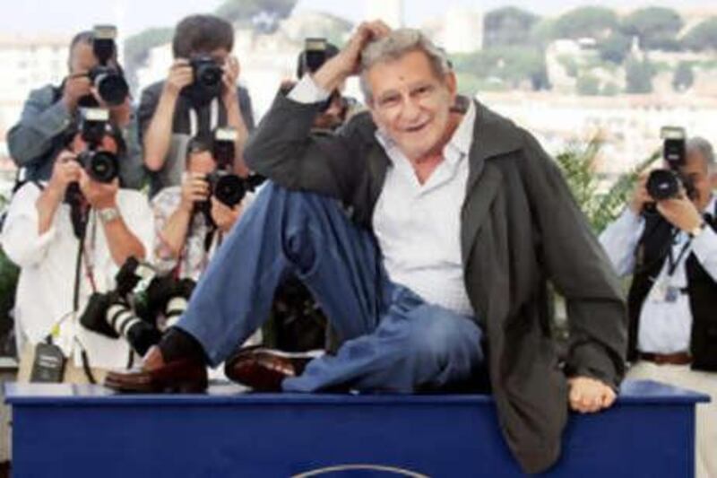 The director Youssef Chahine poses at the Cannes Film Festival, where he received a lifetime achievement award in 1997.