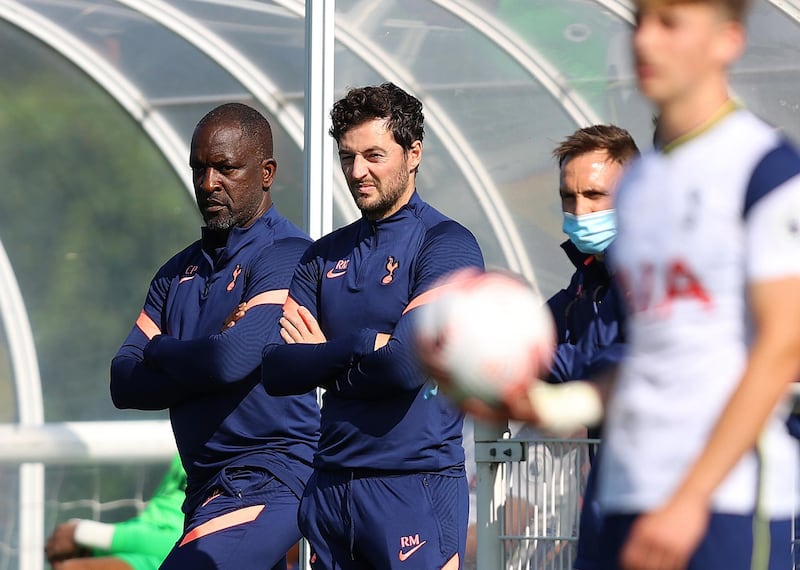 ENFIELD, ENGLAND - SEPTEMBER 18:  Coach Chris Powell with coach Ryan Mason of Spurs look on during the Premier League 2 match between Tottenham Hotspur and West Ham United at Tottenham Hotspur Training Centre on September 18, 2020 in Enfield, England. (Photo by Julian Finney/Getty Images)