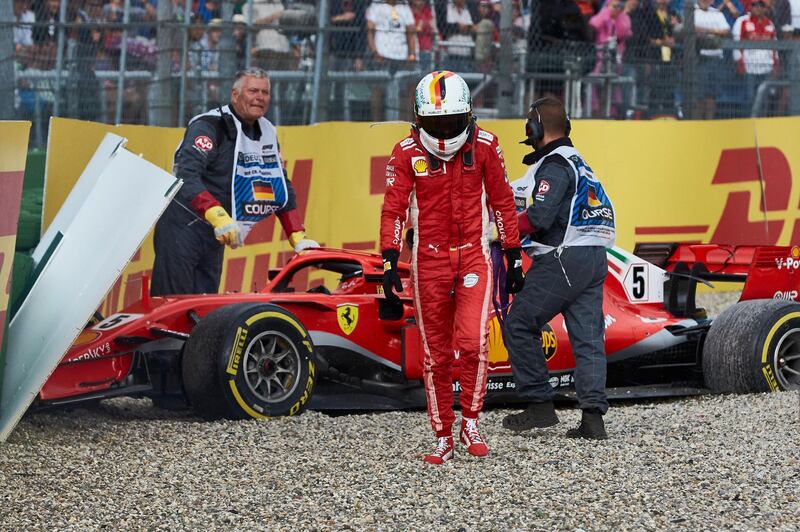 HOCKENHEIM, GERMANY - JULY 22: Sebastian Vettel of Germany and Ferrari walks from his car after crashing during the Formula One Grand Prix of Germany at Hockenheimring on July 22, 2018 in Hockenheim, Germany.  (Photo by Getty Images/Getty Images)