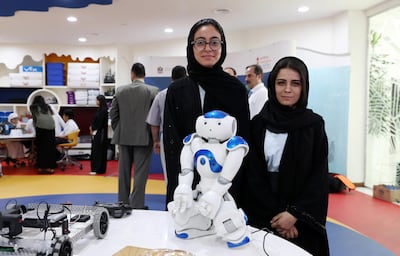DUBAI ,  UNITED ARAB EMIRATES , SEPTEMBER 17 – 2019 :- Left to Right – Reema Humaid and Amani Mohamed of Al Mawahed school Abu Dhabi during the round table of Artificial Intelligence & Robotics Competition Series 2019 held at Ministry of Education in Dubai. They are the winner in the 2019 series. ( Pawan Singh / The National ) For News. Story by Anam