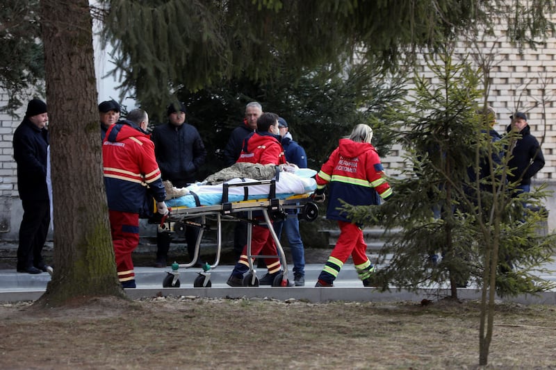 A wounded soldier is transported by medical workers, at a hospital in Novoyavorivsk, after the attack on the Yavoriv military base. Reuters