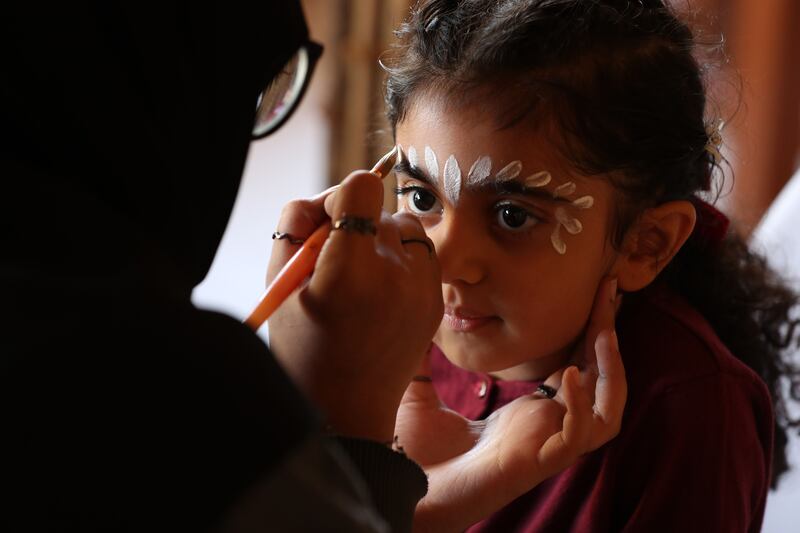 Dana, aged 4, has her face painted
