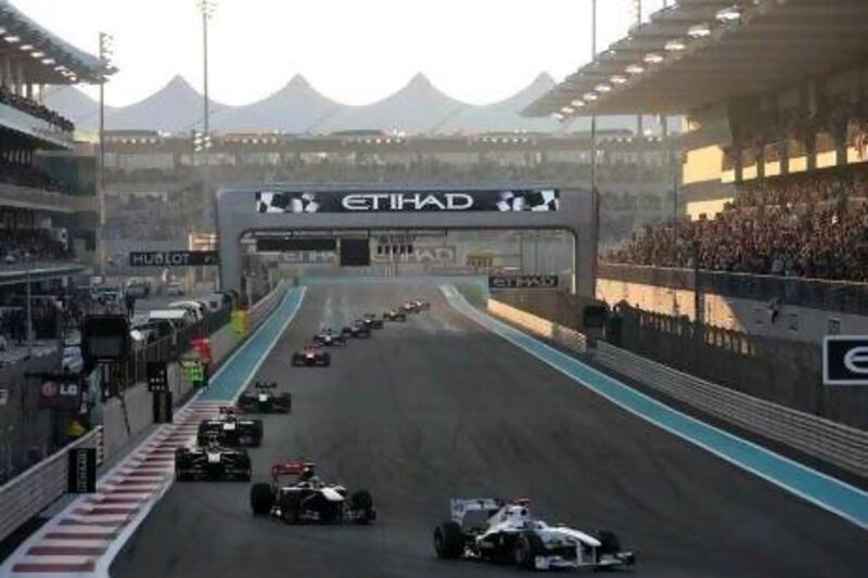 Tens of thousands of race fans watch the Formula One drivers take to the track at the start of last year's Abu Dhabi Grand Prix at the Yas Marina Circuit.