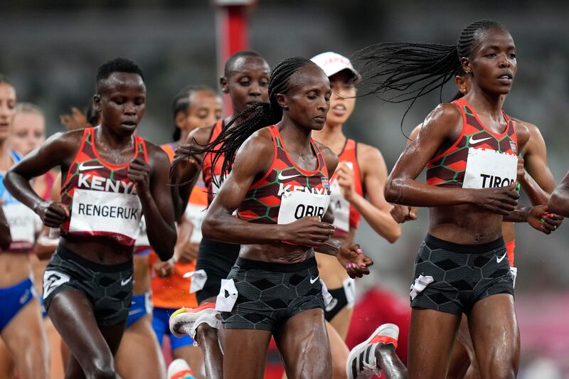 Kenya's Lilian Rengeruk, Hellen Obiri, centre, and Agnes Tirop, right, compete in the women's 5,000-meters final, at the 2020 Summer Olympics, Monday, August  2, 2021, in Tokyo. Tirop finished the race in fourth place. AP Photo