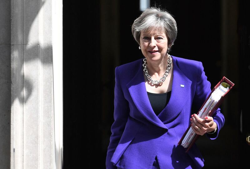 Britain's Prime Minister Theresa May leaves 10 Downing Street in London, bound for the House of Commons to face Prime Minister's Questions, Wednesday July 4, 2018. (Stefan Rousseau/PA via AP)