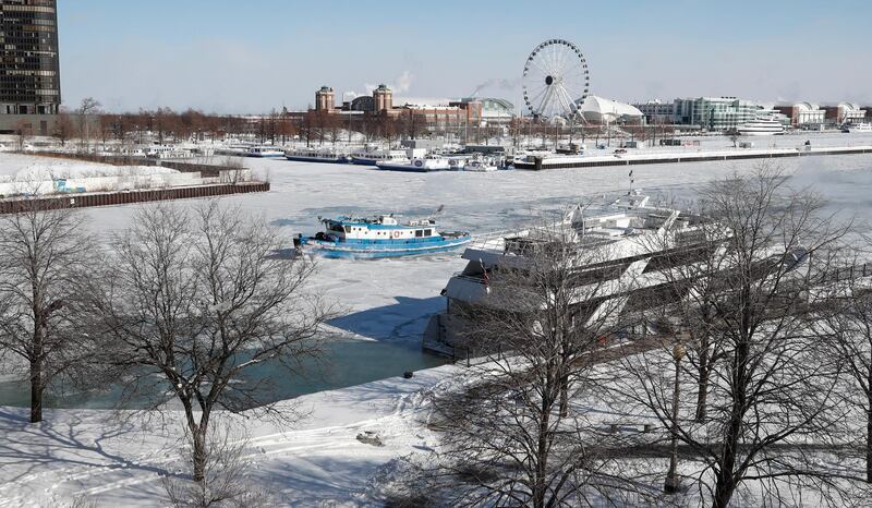 The James Versluis breaks ice on the frozen Chicago River near Navy Pier in Chicago. EPA