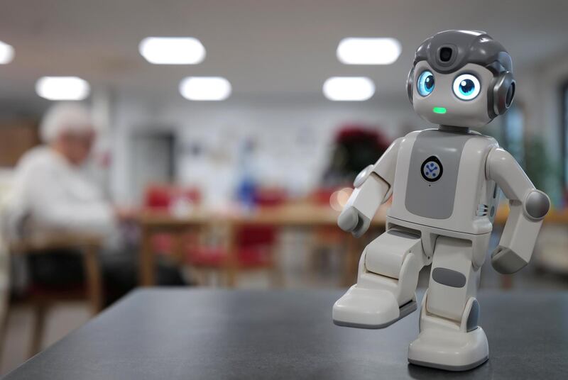 Mini humanoid robot "Alpha Mini" brightens up the daily life of guests at the day care centre of German welfare organisation Caritas in Erlenbach, Germany. Reuters