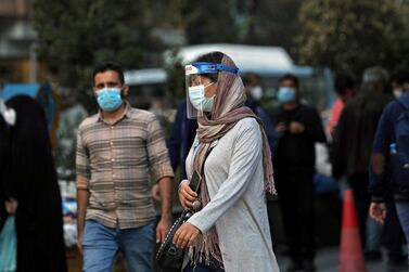 An Iranian woman wears a mask and face shield, amid a rise in coronavirus infections, in Tehran. Image: Reuters