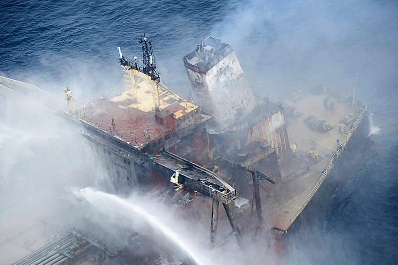 Fireboats battling to extinguish a fire on the Panamanian-registered crude oil tanker New Diamond, some 60km off Sri Lanka's eastern coast where a fire was reported inside the engine room. AFP
