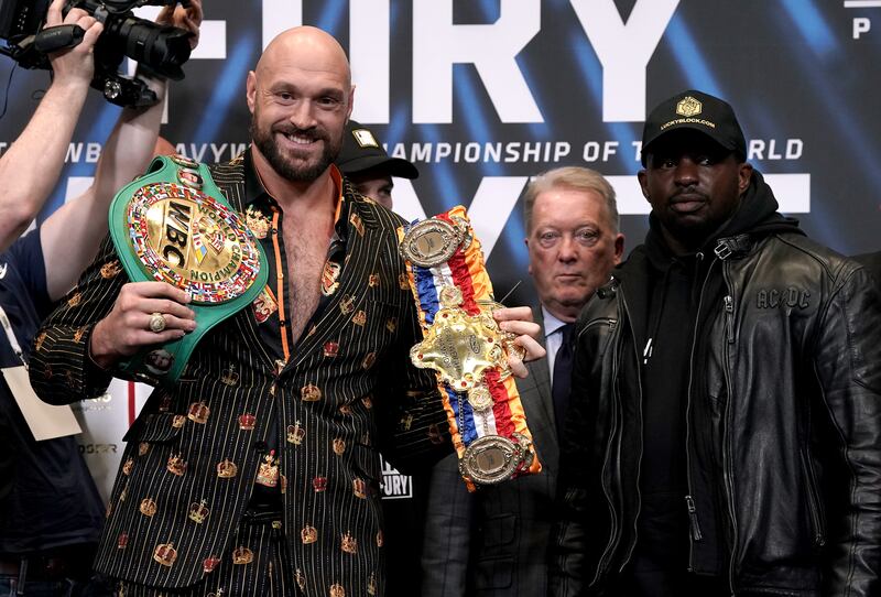 Tyson Furym left, and Dillian Whyte at the Wembley Stadium in London on Wednesday April 20, 2022. PA