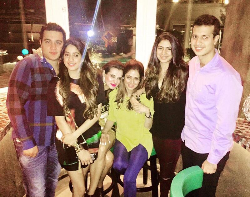 Sridevi is seated with Dubai resident Rekha Tourani during a visit to the UAE. (L to R) Rekha's son Dusty Tourani, Sridevi's daughters Janhvi and Khushi,  and Rekha's son Tubby Tourani. Courtesy Rekha Tourani