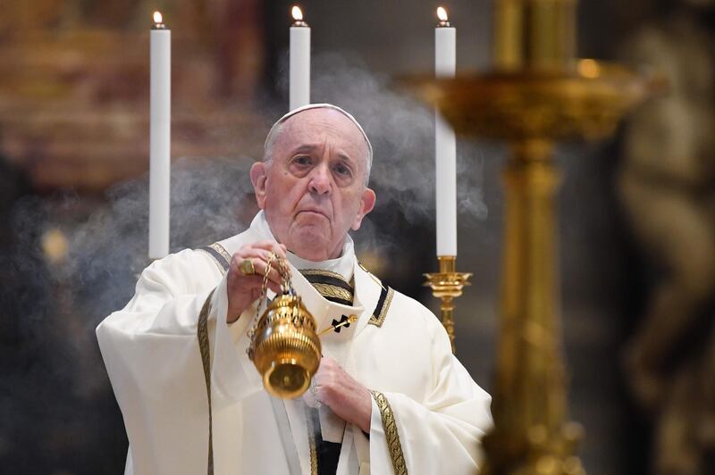 Pope Francis swings a thurible at the start of Easter Sunday Mass behind closed doors at St. Peter's Basilica in The Vatican.  AFP