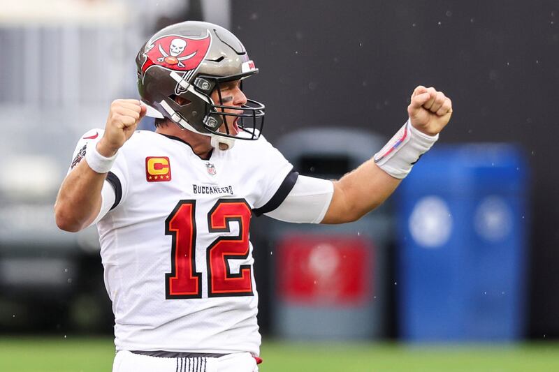 TAMPA, FLORIDA - OCTOBER 04: Tom Brady #12 of the Tampa Bay Buccaneers celebrates after defeating the Los Angeles Chargers after a game at Raymond James Stadium on October 04, 2020 in Tampa, Florida. (Photo by James Gilbert/Getty Images)