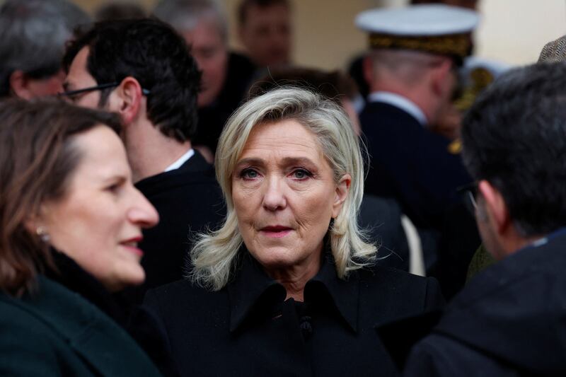 Marine Le Pen, of the French far-right National Rally party, arrives for the ceremony. AP