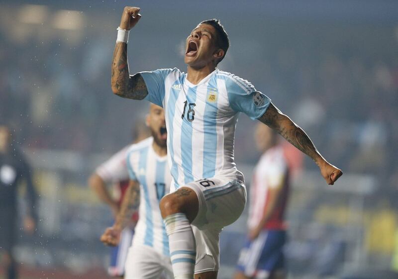 Marcos Rojo of Argentina celebrates his opening goal for his side on Tuesday night against Paraguay. Carlos Succo / EPA